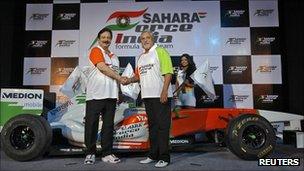 Vijay Mallya (R), co-owner of the Force India Formula One team, and Sahara Group chairman Subrata Roy