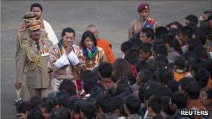 King Jigme Khesar Namgyel Wangchuck and Queen Jetsun Pema greet villagers after their wedding