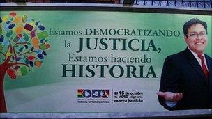 Election poster: "We are democratising justice, we are making history"