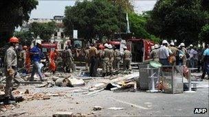 Fire-fighters and rescue officials at the scene of the blast in Rio de Janeiro