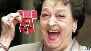 Betty Driver with her MBE in 1999