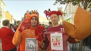 Workers dressed as crabs