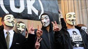 Protesters in Guy Fawkes masks