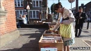 Resident looks at donated books outside Kensal rise library