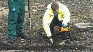 Sepa officers searching for radioactive particles on Dalgety Bay beach Pic John Easton