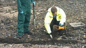 Sepa officers searching for radioactive particles on Dalgety Bay beach Pic John Easton