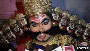 A man dressed up as the demon king Ravan in Allahabad on 23 September 2011