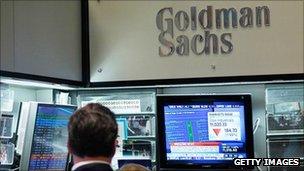 Goldman Sachs sign and trading screens