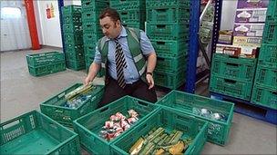 Man sorting food at depot