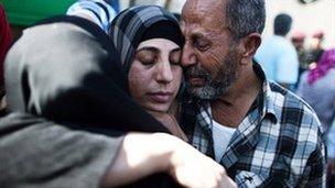 A Palestinian prisoner hugs relatives after arriving in Mukata following her release on October 18, 2011 in Ramallah, West Bank.