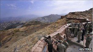 Turkish President Abdullah Gul gets a briefing from army officers during a visit to a military post in Hakkari province in south-eastern Turkey on 15 October 2011