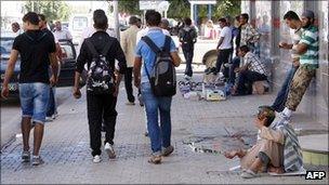 People on a street in Sidi Bouzid on 13 October