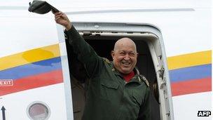 President Hugo Chavez waves from the plane on landing at the airport in Venezuela, on 20 October 2011.