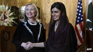 US Secretary of State Hillary Clinton (L) shakes hands with Pakistan"s Foreign Minister Hina Rabbani Khar after a joint press conference at the Pakistani Foreign Ministry in Islamabad on October 21, 2011.