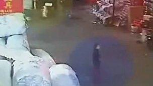 Toddler Wang Yue stands in the road shortly before her accident on 13 October 2011