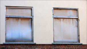 Empty boarded-up homes