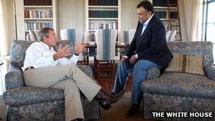 US President George W. Bush (L) meeting with Saudi Arabian Ambassador to the US Prince Bandar bin Sultan