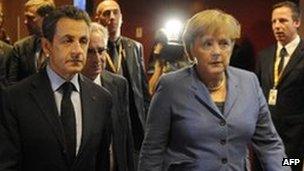 French President Nicolas Sarkozy (left) and German Chancellor Angela Merkel in Brussels - 23 October 2011