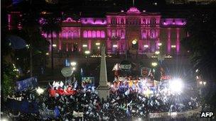 Supporters in the Plaza de Mayo with the presidential place, the Casa Rosada or Pink House, in the background