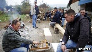 Kosovo Serbs play chess at the barricades in the village of Zupce