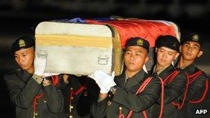 Philippine military personnel carry the coffin of a soldier killed in a rebel ambush on October 19th