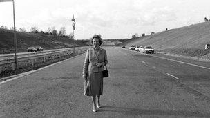 Prime Minister Margaret Thatcher stands on an empty stretch of motorway in 1986 on the day she opened the "missing link" at Radlett, Hertfordshire.