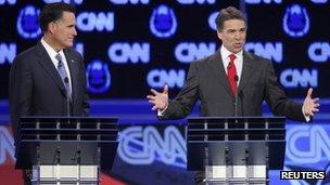 Mitt Romney and Rick Perry at a presidential debate on 18 October 2011