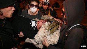 24-year old Iraqi war veteran Scott Olsen is carried away on 25 October 2011