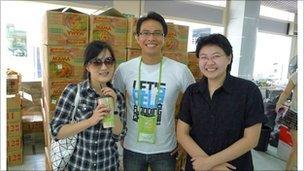 Rungsun Munkong and two volunteers at the flood relief centre in Bangkok