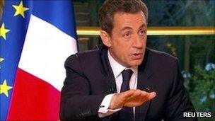 France's Nicolas Sarkozy speaks to journalists, 27 October