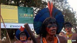 Caiapo indigenous men demonstrating on the road leading to the construction site of the Belo Monte hydroelectric dam