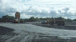 Earthmovers at work on the Phoenix School site in Dawley