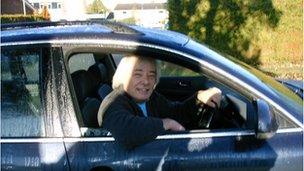 Bob Dobbs sitting in his car