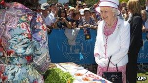 Queen Elizabeth talks to a chef at the "Great Aussie Barbecue" in Perth