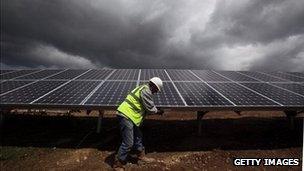 A man installing solar panels