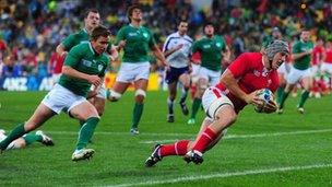 Jonathan Davies scores a try against Ireland in a quarter final match during the 2011 Rugby World Cup