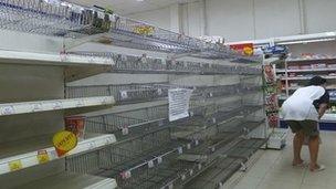 Empty shelves in a Bangkok supermarket. Photo by Andrew Batt