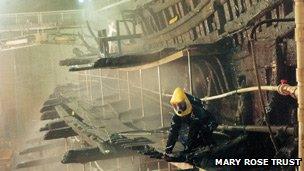 A restorer works on the Mary Rose wreck