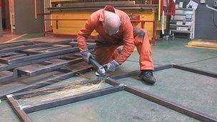 One of the Altcourse inmates welds metal in the prison's workshop