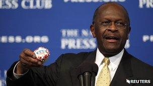 Republican presidential candidate Herman Cain speaks at the National Press Club in Washington, DC, 31 October 2011