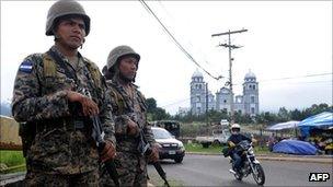 Honduran troops at a checkpoint in the capital, Tegucigalpa.