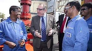 First Minister Alex Salmond chats with technicians during a visit to Weir's existing facility in Dubai