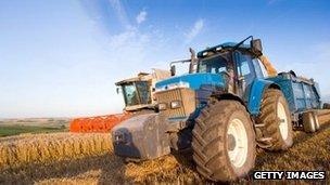 A tractor and combine harvester