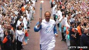 Sir Steve Redgrave carries the Olympic torch