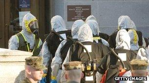 Hazmat workers enter the Russell Senate Office building on Capitol Hill 4 February 2004