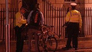 Police officers speaking to cyclists in Oxford