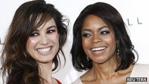 Actors Berenice Marlohe (L) and Naomie Harris pose while launching the start of production of the new James Bond film "SkyFall" at