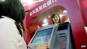 High-tech cash machines being exhibited at a trade fair in Beijing on 13 February 2007