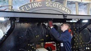 Apprentice engineer Andy Christie carries out work on the chassis of the Flying Scotsman