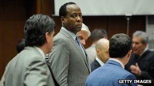 Dr Conrad Murray, surrounded by his defence attorneys at Los Angeles Superior Court on 1 November 2011